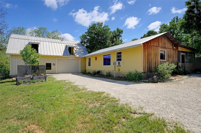 view of front facade with a front yard and a garage