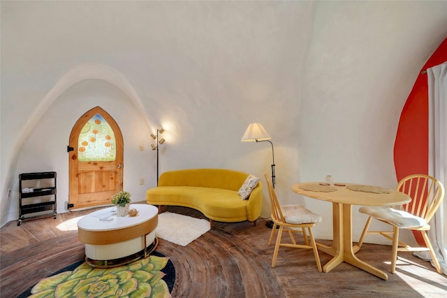 sitting room featuring wood-type flooring and lofted ceiling