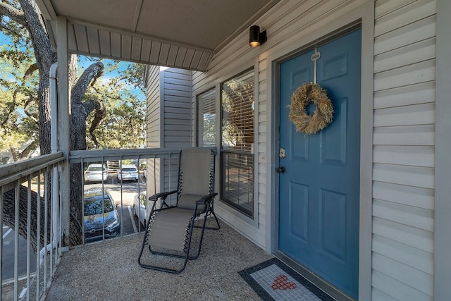 view of exterior entry with a porch