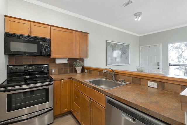 kitchen featuring tasteful backsplash, crown molding, sink, and appliances with stainless steel finishes