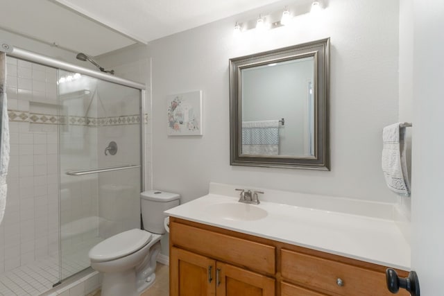 bathroom with vanity, toilet, and walk in shower