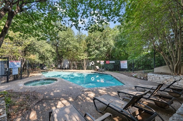 view of pool featuring a hot tub