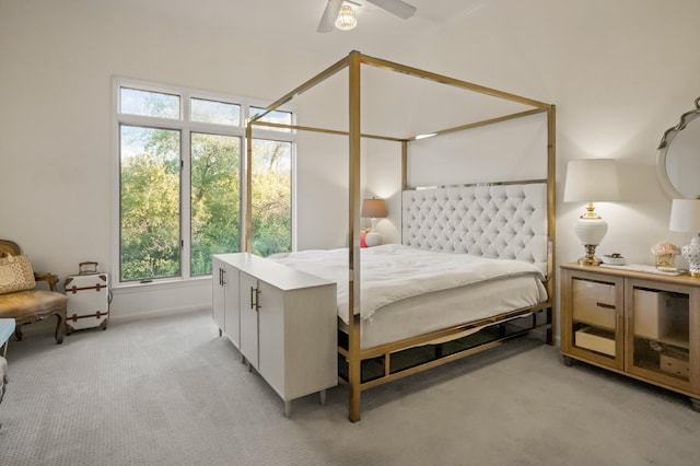 bedroom featuring a ceiling fan and light carpet