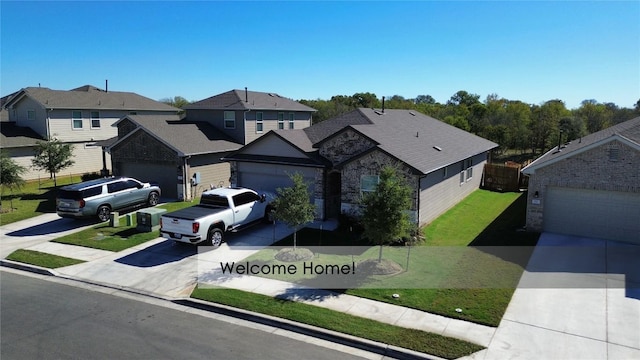 view of front of home featuring a garage and a front lawn