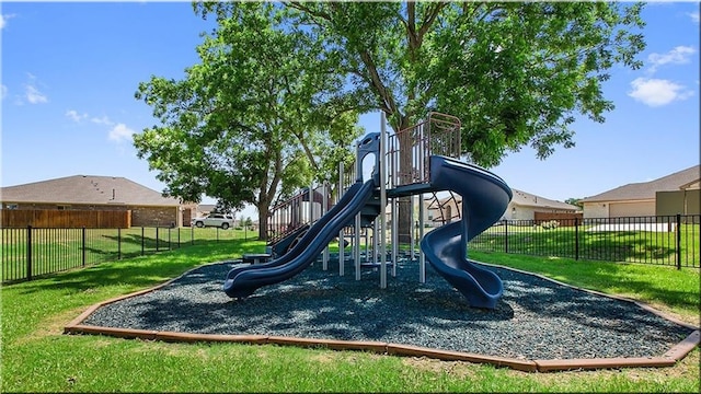 view of jungle gym featuring a lawn