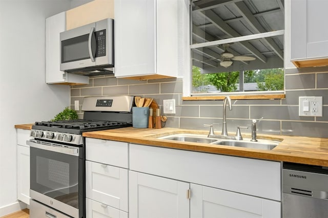 kitchen featuring white cabinetry, sink, and stainless steel appliances