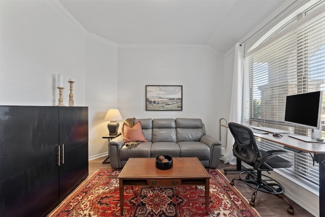 home office with crown molding, hardwood / wood-style floors, and lofted ceiling