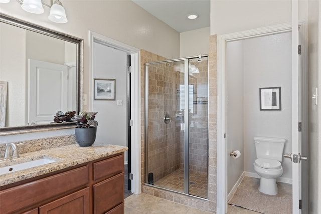 bathroom featuring tile patterned floors, vanity, walk in shower, and toilet