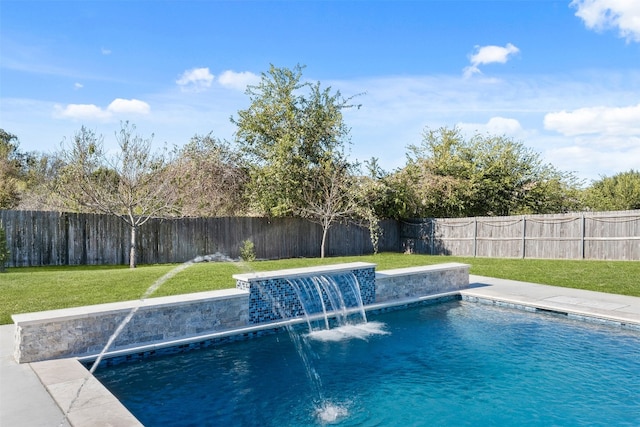 view of swimming pool featuring pool water feature and a yard