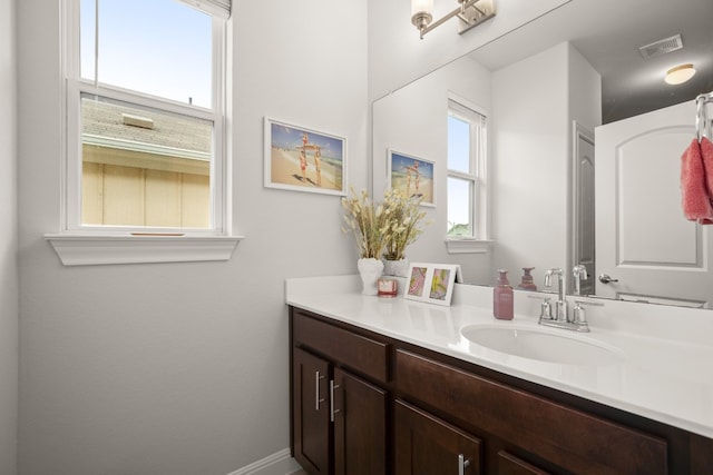 bathroom featuring visible vents and vanity