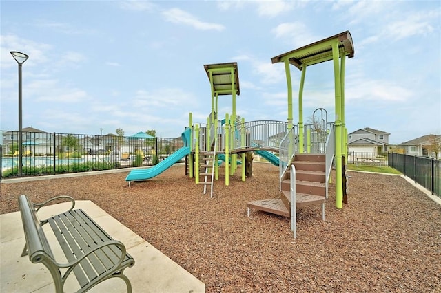 communal playground featuring fence