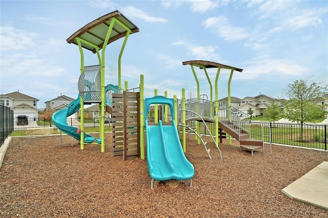 communal playground featuring fence and a residential view