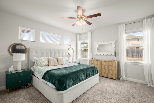 bedroom featuring multiple windows and ceiling fan