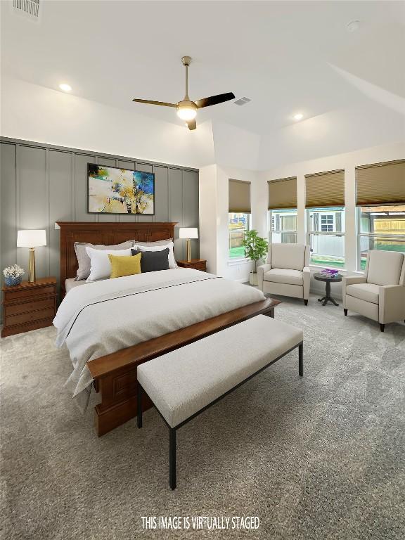 carpeted bedroom with multiple windows, visible vents, and a decorative wall