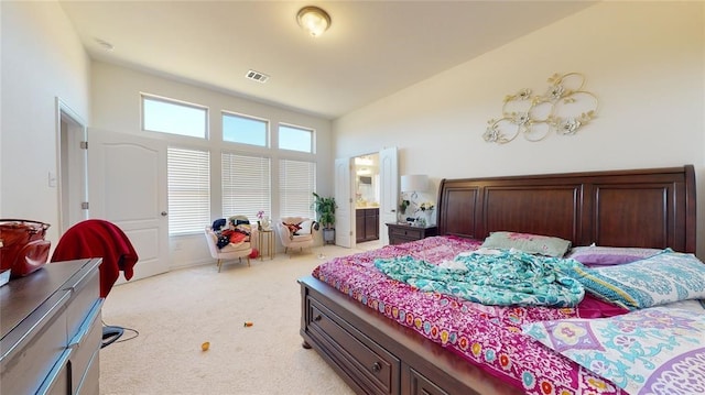 bedroom featuring high vaulted ceiling and light carpet