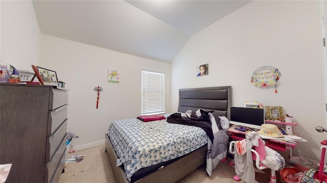 carpeted bedroom featuring lofted ceiling