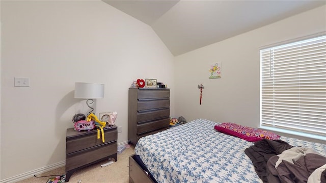 carpeted bedroom with vaulted ceiling