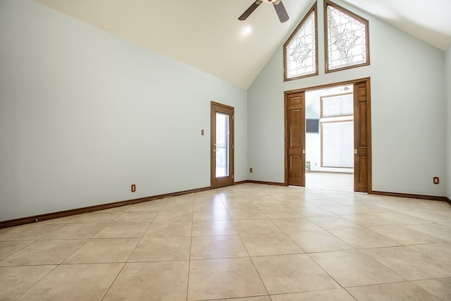 entrance foyer with light tile patterned floors, high vaulted ceiling, and ceiling fan