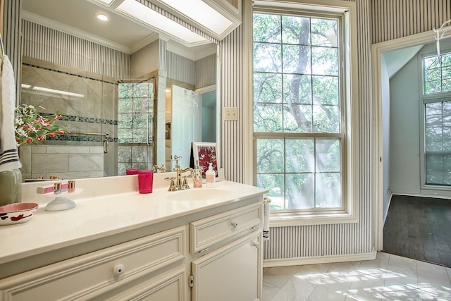 bathroom with vanity, wood-type flooring, and crown molding