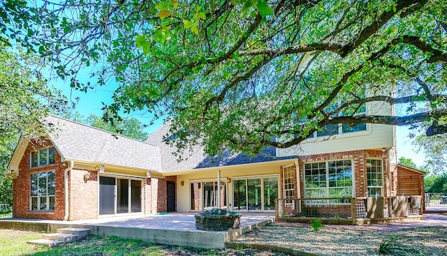 rear view of house with a patio area