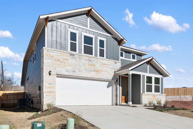 view of front facade featuring central AC and a garage