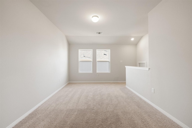 spare room with light colored carpet