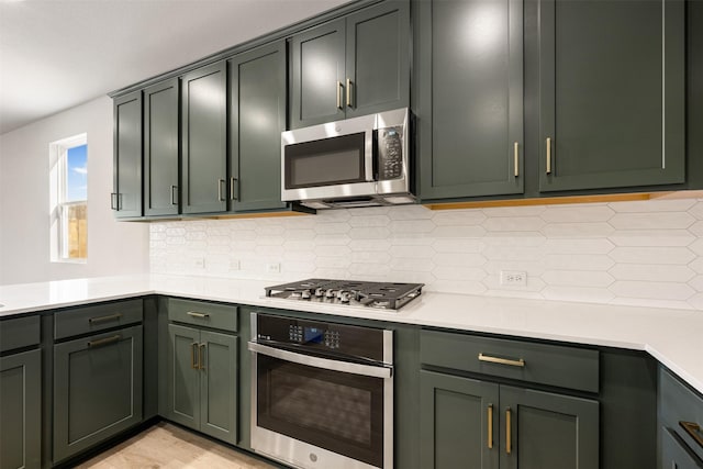 kitchen with decorative backsplash and appliances with stainless steel finishes