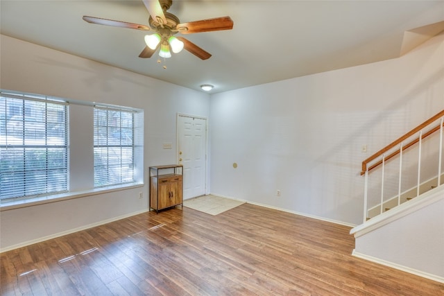 interior space with hardwood / wood-style floors and ceiling fan