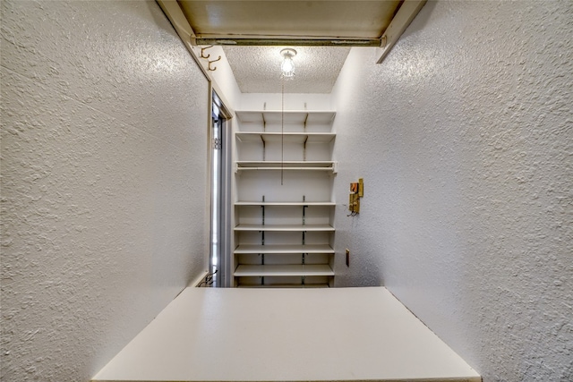 interior space with a textured ceiling