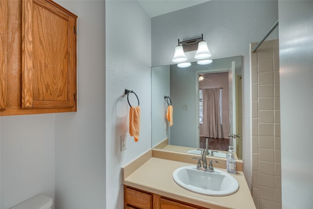 bathroom featuring vanity and toilet