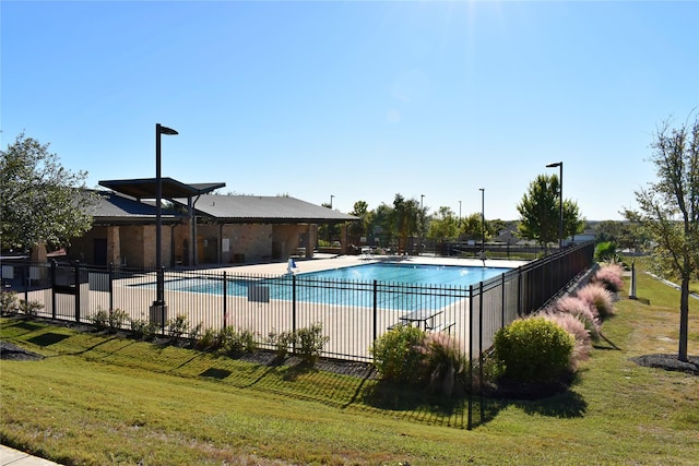 view of pool featuring a yard and a patio area