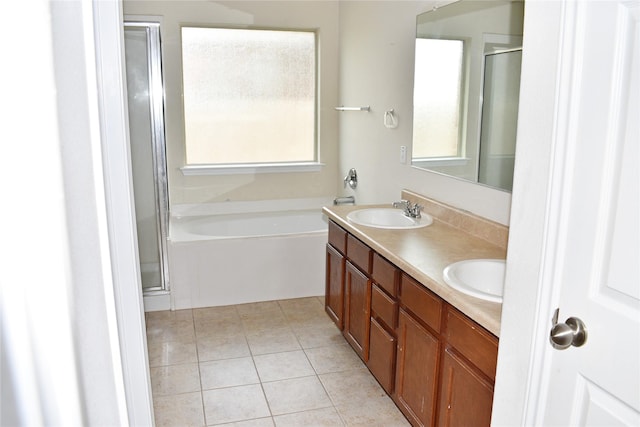 bathroom featuring vanity, tile patterned floors, and separate shower and tub