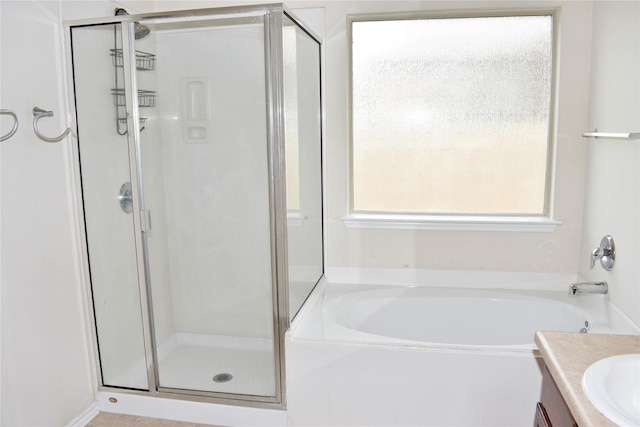 bathroom featuring separate shower and tub and vanity