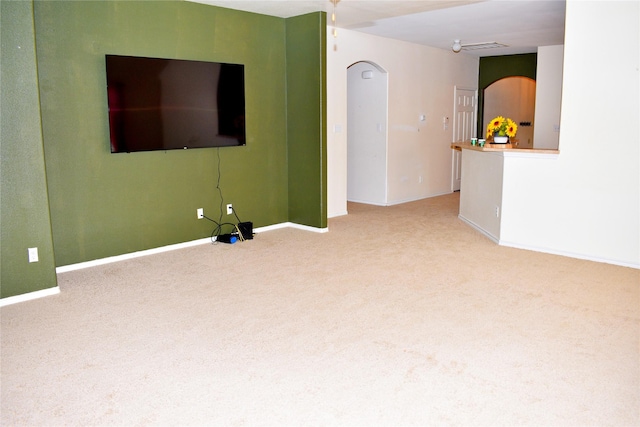 unfurnished living room with carpet flooring