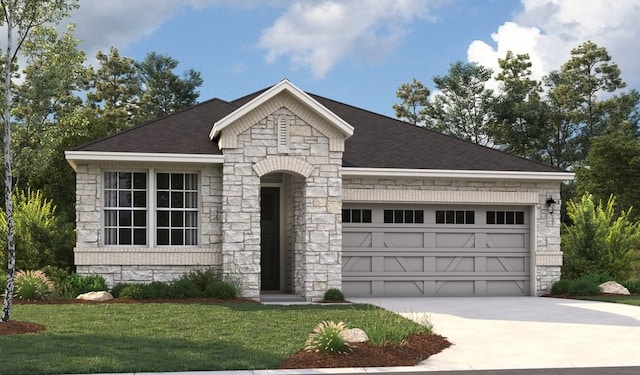 view of front of home featuring a garage and a front lawn