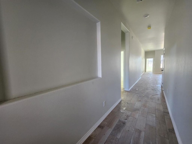 hallway featuring hardwood / wood-style floors