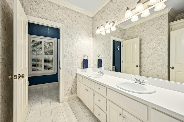 bathroom with tile patterned floors, vanity, and crown molding