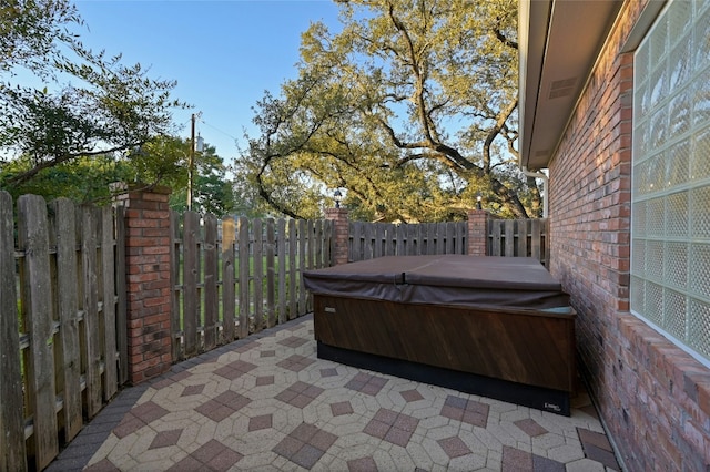 view of patio / terrace featuring a hot tub