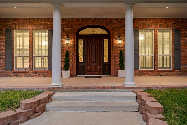 doorway to property featuring a porch