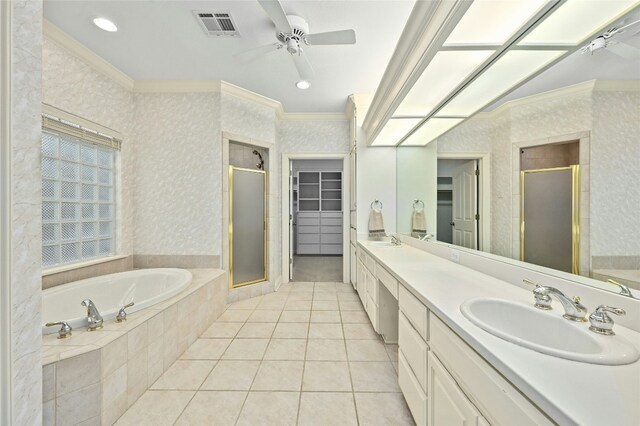 bathroom featuring tile patterned floors, vanity, crown molding, and independent shower and bath