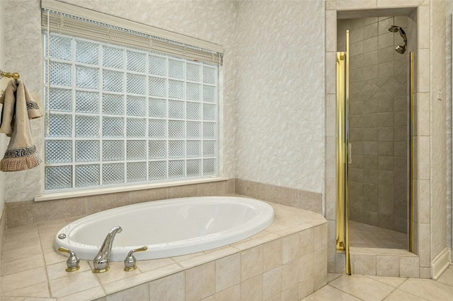 bathroom with tile patterned flooring and independent shower and bath