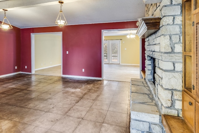 interior space featuring a fireplace and a textured ceiling