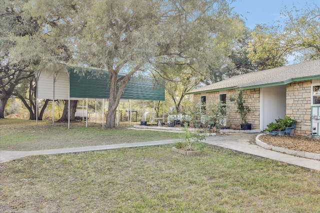 view of yard with a carport