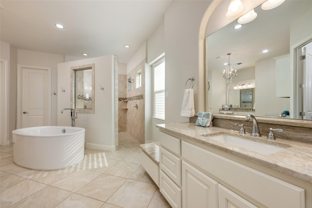 bathroom featuring tile patterned floors, vanity, and separate shower and tub