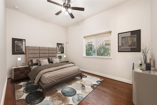 bedroom with dark wood-type flooring and ceiling fan