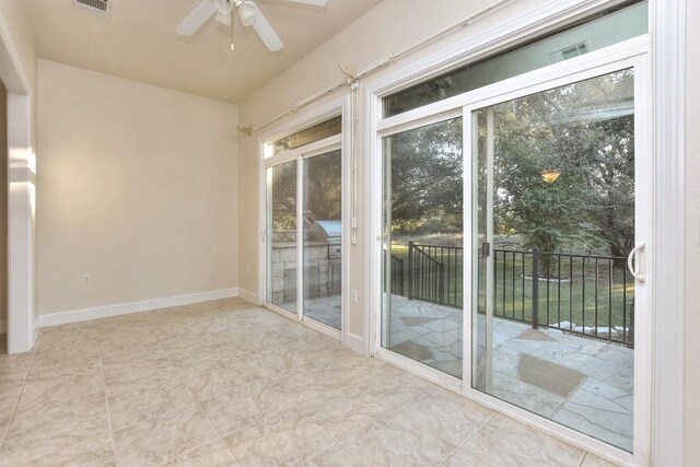 interior space featuring ceiling fan