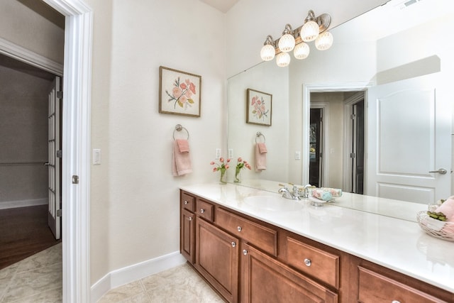 bathroom featuring tile patterned flooring and vanity