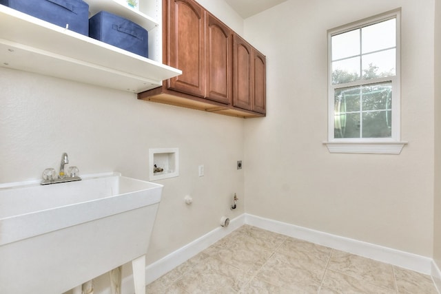 washroom with sink, cabinets, hookup for an electric dryer, hookup for a gas dryer, and hookup for a washing machine