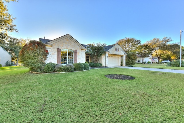 ranch-style house with a garage and a front yard