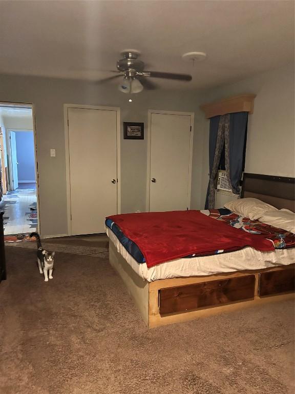 carpeted bedroom with ceiling fan